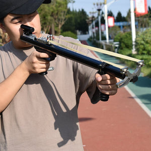 Rosy Brown A Black Slingshot Rifle With Aming Laser For Outdoor Hunting And Shooting Can Be Used With A Variety Of Rubber Bands